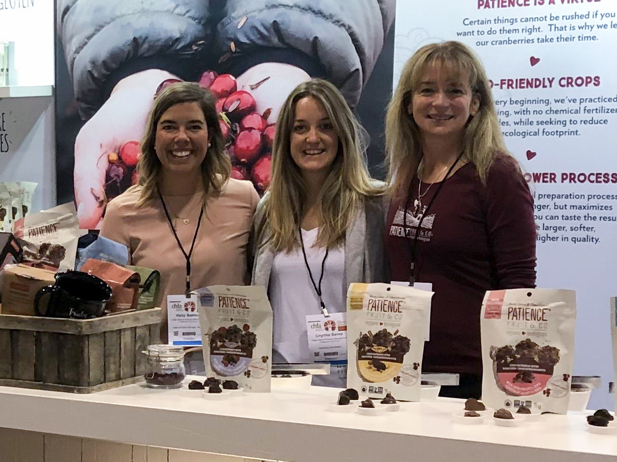 sales representatives at a Patience Fruit & Co kiosk